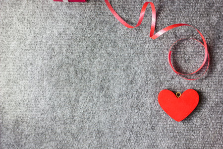 Red wooden heart on grey background - Valentine's day background
