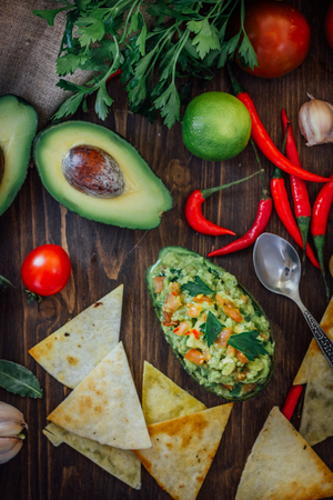 Avocado boat - guacamole dip in boat made from avocado skinの写真素材