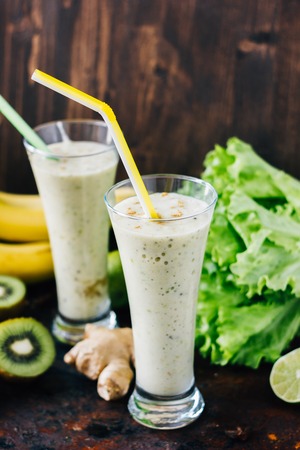 Fresh smothie with banan, kiwi and ginger. Vegan drink.の写真素材