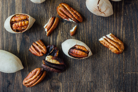 Organic Pecan nuts on brown wooden table
