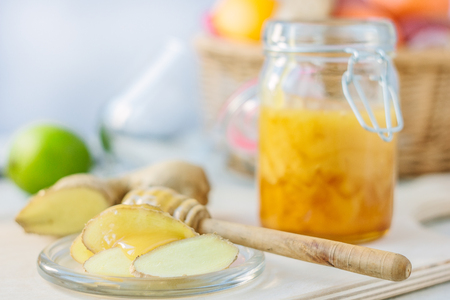 Healthy eating - honey and ginger root slicesの写真素材