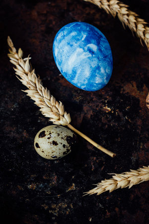 Blue colored easter egg similar to planet Earth.の写真素材
