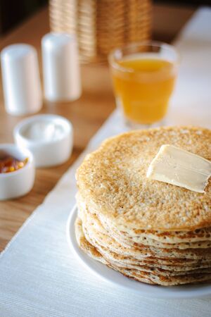 Hip of thin russian pancakes, called blini, at restaurant.の写真素材