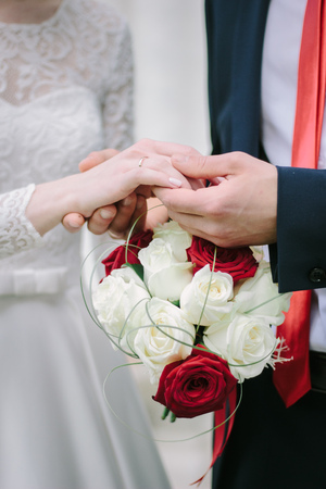 Groom holds the bride hand in self handの写真素材