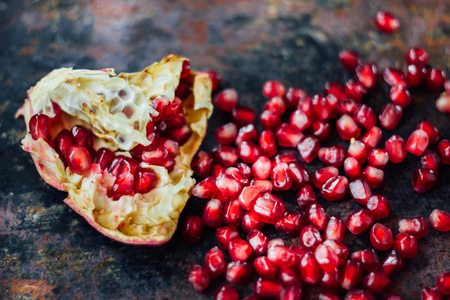 Healthy food background - pomegranate fruit and seeds.の写真素材