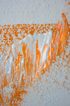 Fresh orange and grey paint on wallの写真素材