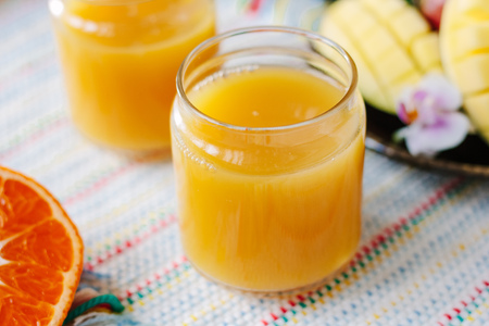 Mango and orange detox juice made from fresh fruits.の写真素材