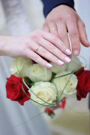 Bride and groom after ceremony showing wedding rings on their fingers.の写真素材