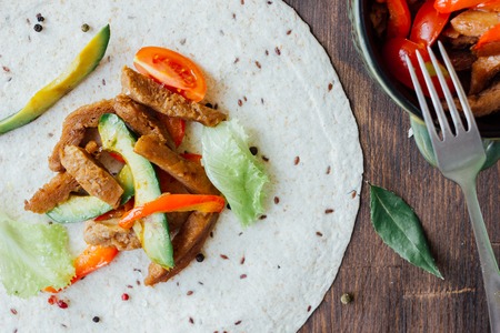 Top view of traditional mexican fajitas on tortilla flatbread.の写真素材