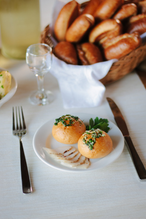 Ukarnian food - round pastries pampushki on ceramic plate.の写真素材