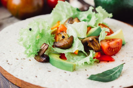 Natural vegetarian mexican food - fresh salad on tortilla bread.の写真素材