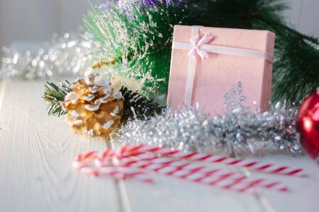 Box with new year gifts and presents on white wooden boardの写真素材