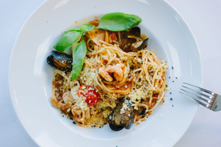 Italian food - spaghetti pasta with seafood - mussels and shrimps.