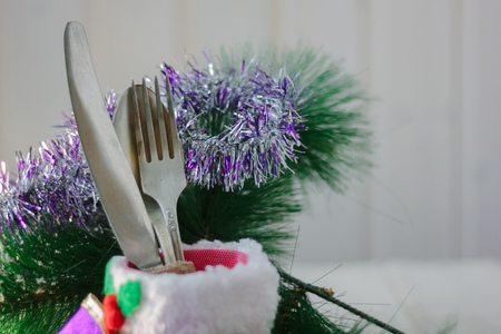 Red santa boot with the silver cutlery inside - as christmas menu decorationの写真素材