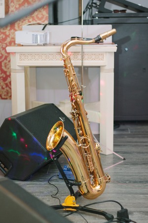 Saxophone staying on the rack at the sceneの写真素材