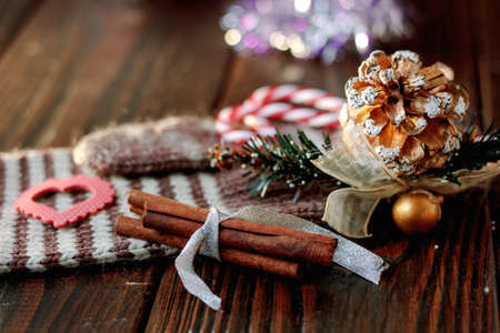 Christmas decoration on wooden table with wool mittensの写真素材