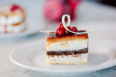 Beautiful and delicious dessert cake at table.