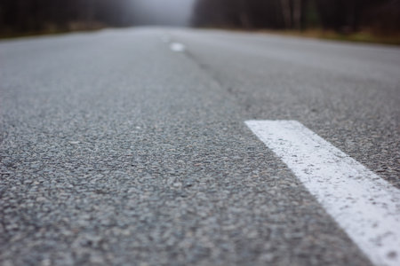 Road at autumn day at countryside, close-up view.の写真素材