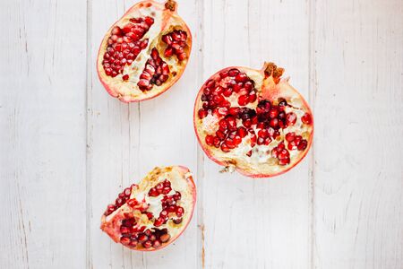 Top view of pomegranate fruit divided on halves.の写真素材