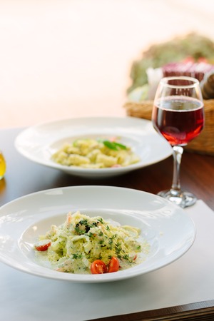 Italian food - fettuccine pasta with spinach and seafoodの写真素材