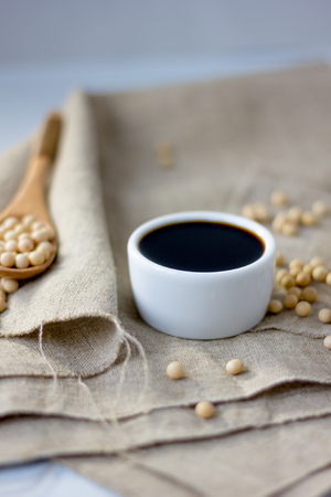 White ceramic bowl with soy sauce on kitchen.の写真素材