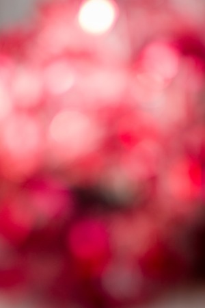 Red blurred christmas and new year glitter background.の写真素材