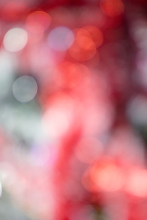 Red blurred christmas and new year glitter background.の写真素材