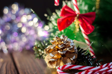 Christmas decoration - pinecone with christmas candy canes.