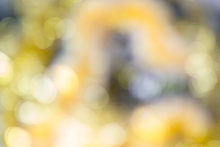 Yellow glitter blurred background for christmas celebration.の写真素材
