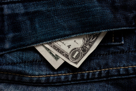 USA dollar, aka buck in a blue jeans pocket.