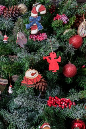 Christmas tree decorated by toys, balls and roses.の写真素材