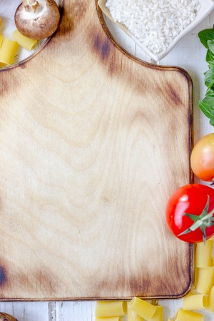 top view of vegetables and kitchen board background.の写真素材