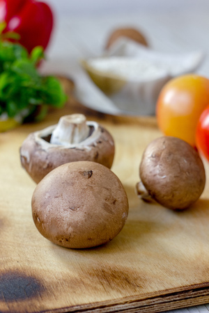 Portobello champignon on a kitchen wooden tableの写真素材