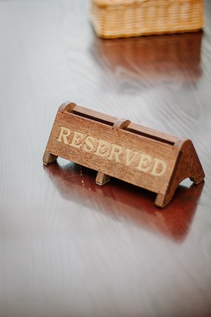 Reserved plate on table on a restaurant or cafeの写真素材