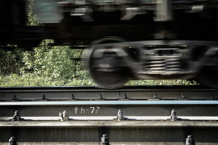 Railway carriage on rails, moving, blured by low shutter speed.の写真素材