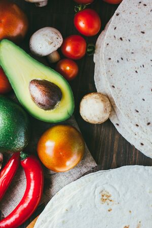 Corn tortilla with vegetables on table.の写真素材