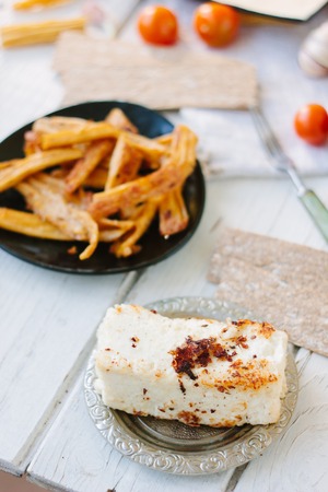 Roasted tofu - popular vegetarian cheese, in metal plateの写真素材