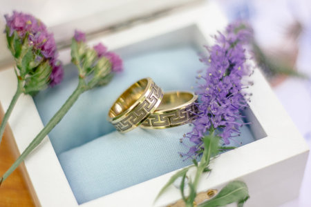 The wedding rings with flowers, marriage concept.