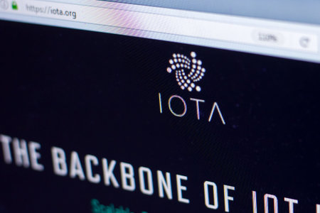 Ryazan, Russia - March 29, 2018 - Homepage of IOTA cryptocurrency on the PC display, web address -...