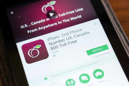 Ryazan, Russia - June 24, 2018: iPlum 2nd phone Number mobile app on the display of tablet PCのeditorial素材