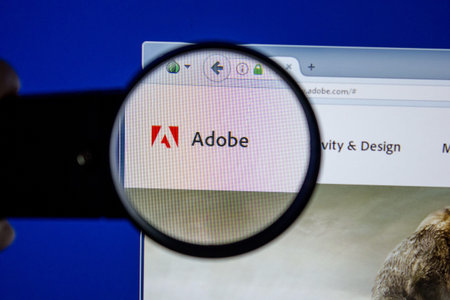 Ryazan, Russia - July 11, 2018: Adobe.com website on the display of PC