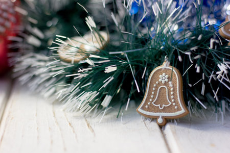 Christmas bell on decoration over white wooden table
