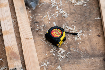 Ryazan, Russia - July 27, 2019: Measuring tape on the wooden surface.