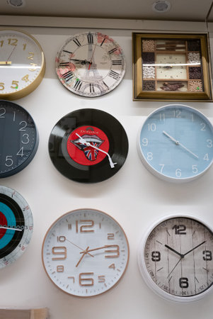 Ryazan, Russia - October 01, 2019: A lot of different wall clocks in a market.