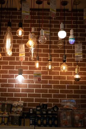 Ryazan, Russia - October 01, 2019: Light bulbs in a market on a brick wallのeditorial素材