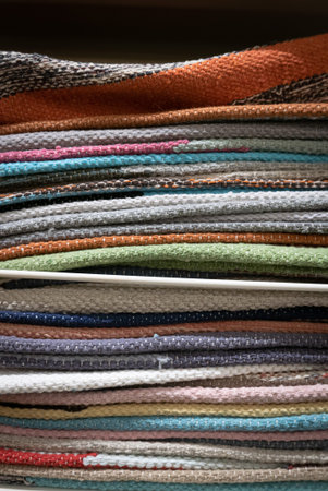 Pile of small welcome carpets or doormats.