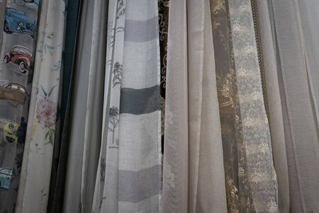 Curtains of different colors and styles in the shop.の写真素材