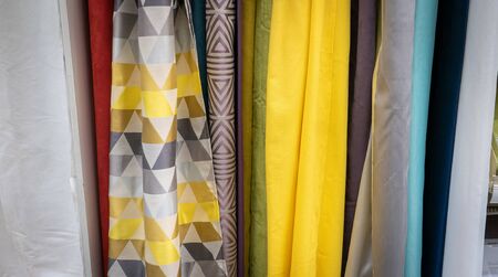 Curtains of different colors and styles in the shop.の写真素材
