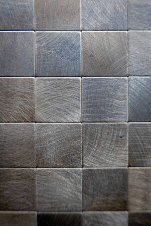 Gray ceramic mosaic on the wall as background.の写真素材