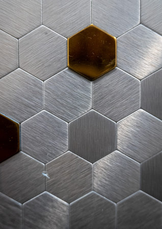 Decorative metal cells on the wall as a background